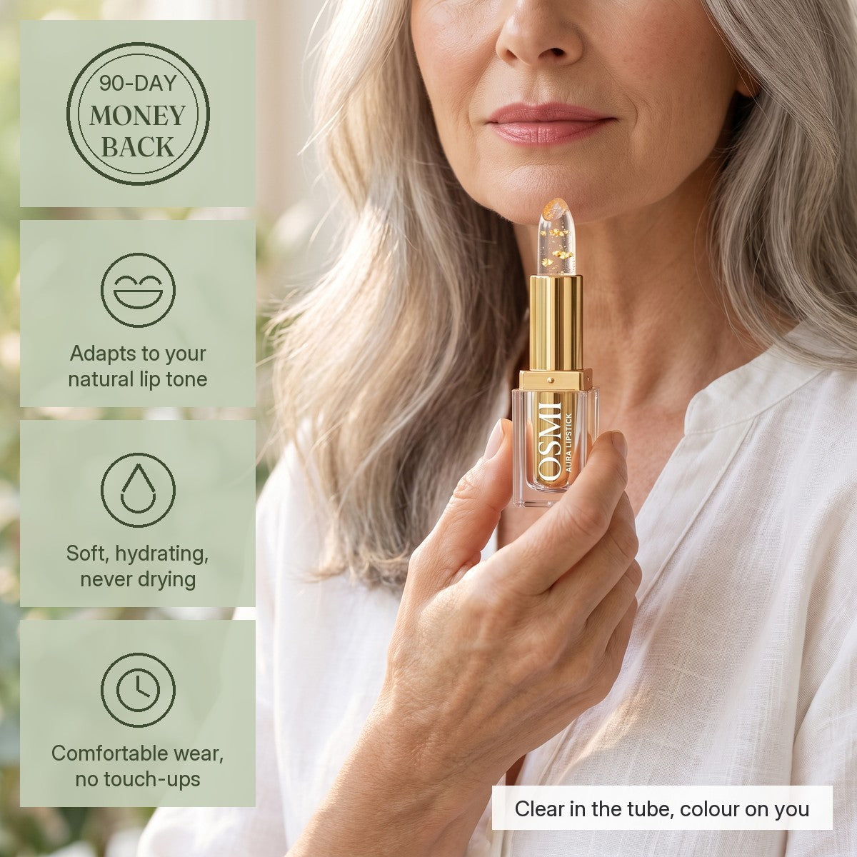 Woman holding OSMI Aura Lipstick in Gold