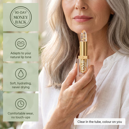 Woman holding OSMI Aura Lipstick in Gold