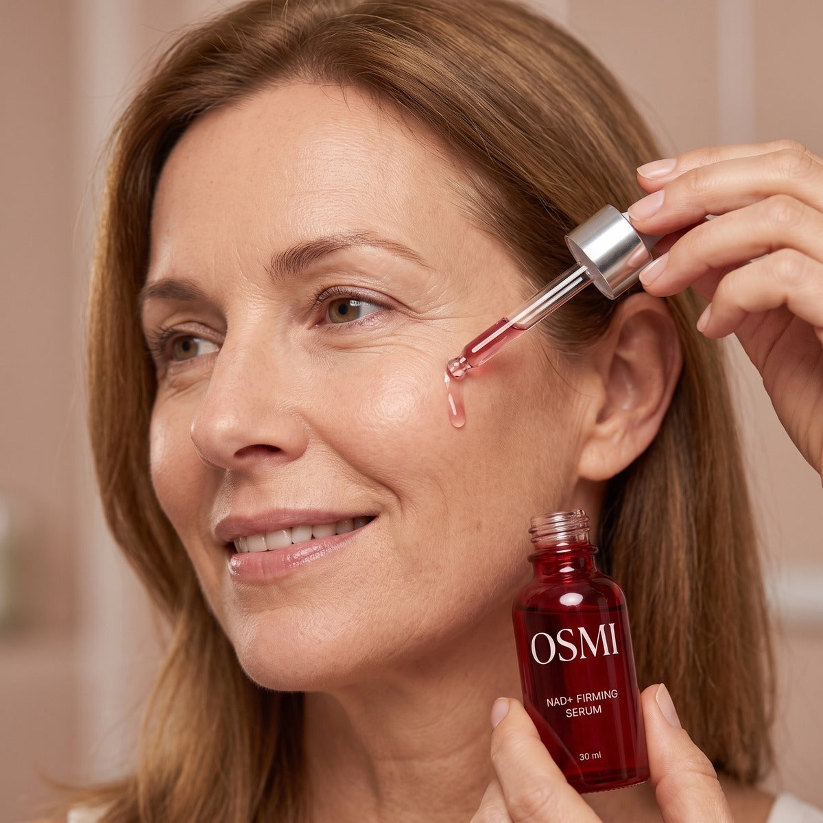Applying OSMI NAD+ Firming Serum with the dropper